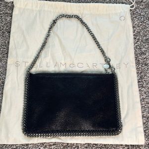 Stella McCartney Black Wristlet could be used as a mini shoulder purse.